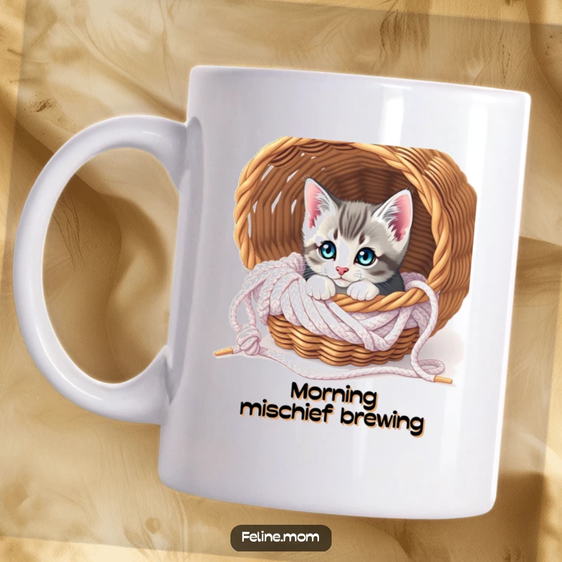 Funny Curious Kitten Knitting Mug: A cute kitten peeks its head out from a basket filled with yarn, looking curious.