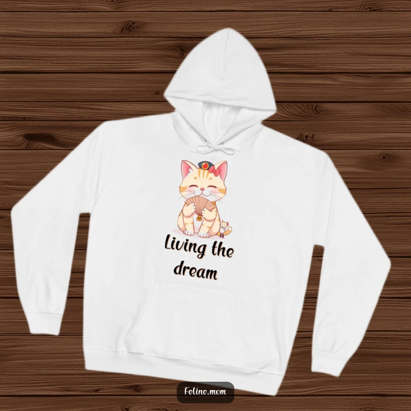 Funny pampered cat hoodie featuring a cat being fanned by a tiny attendant, embodying hilarious luxury and ultimate relaxation.