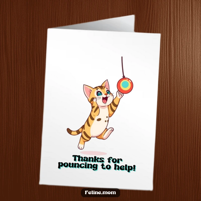 Funny Free Printable Thank You Card featuring a playful Bengal cat leaping towards a suspended toy, an energetic print-at-home way to say thank you.